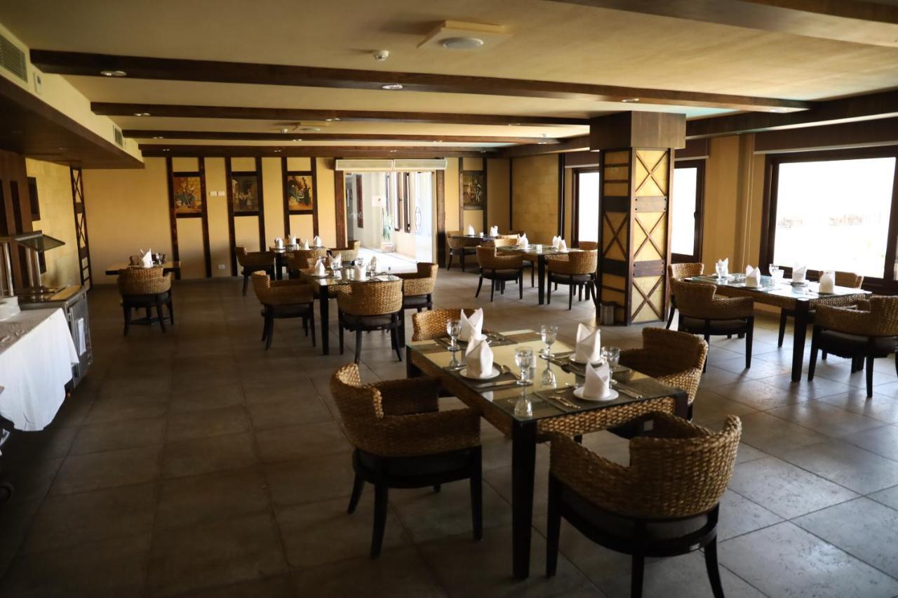 Panacea Suites Hotel Borg El Arab Bagian luar foto