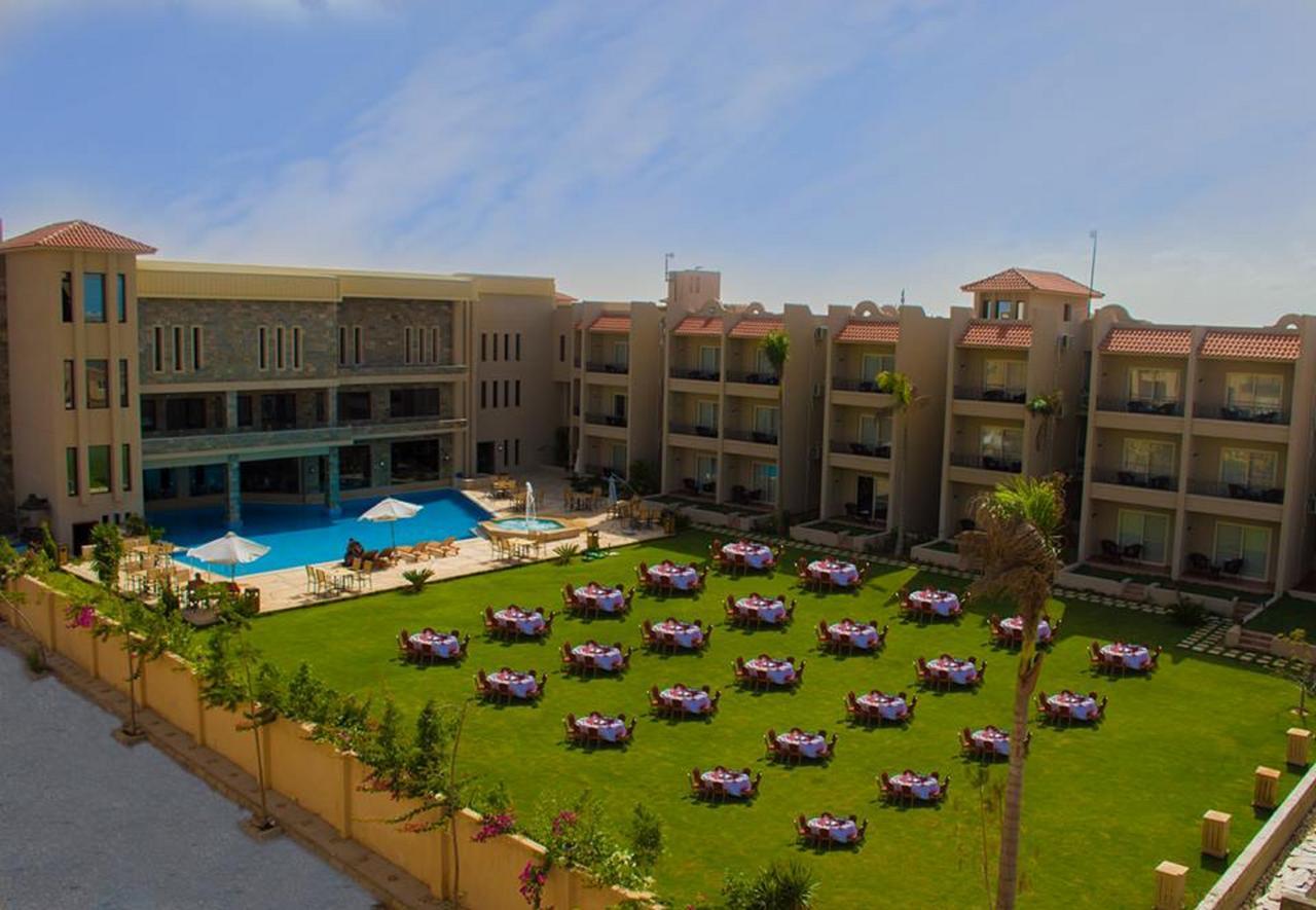 Panacea Suites Hotel Borg El Arab Bagian luar foto
