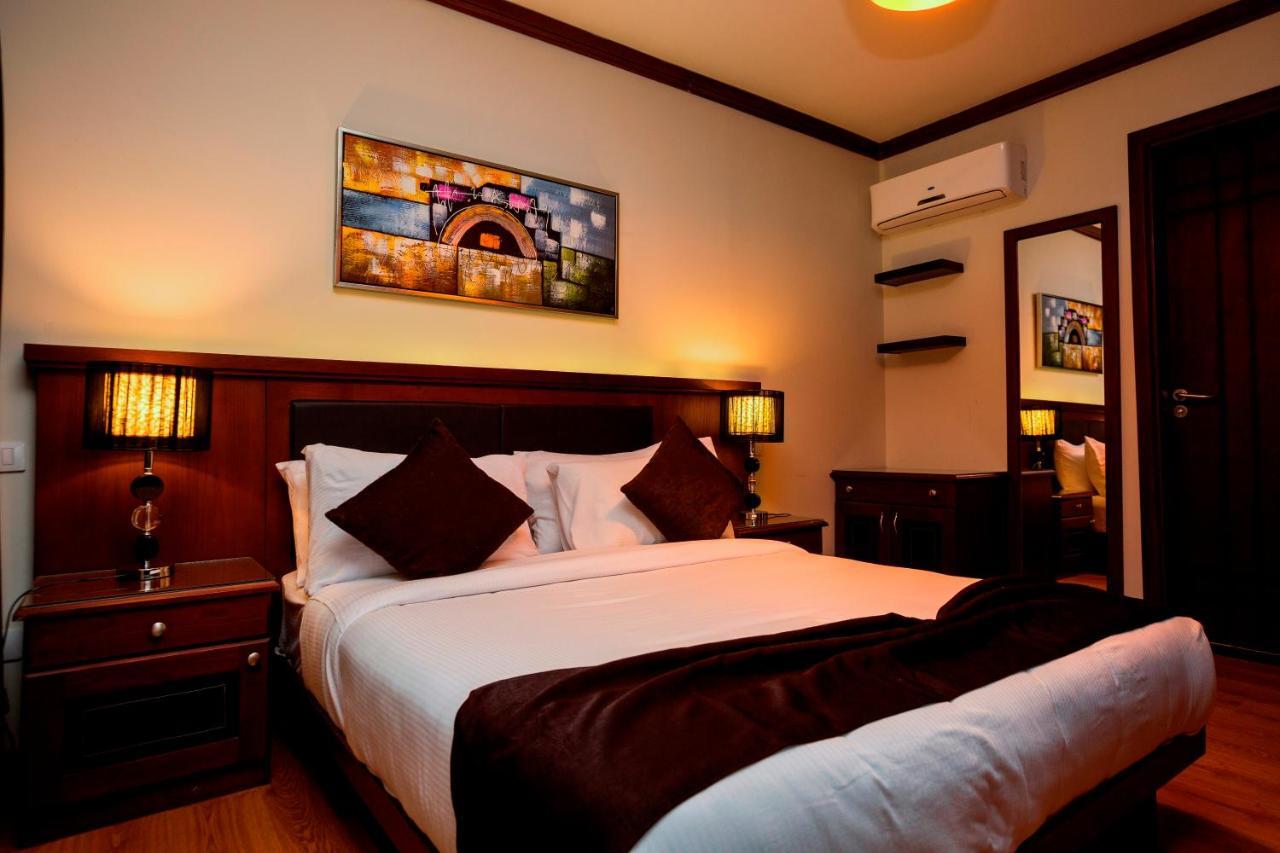 Panacea Suites Hotel Borg El Arab Bagian luar foto